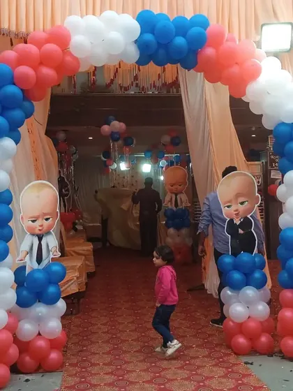 Another angle of the red, white, and blue Boss Baby entrance arch, showing how it creates an exciting entryway for guests arriving at the party venue.