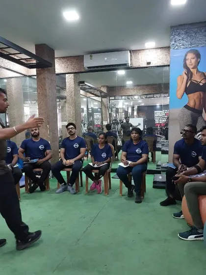 A classroom session in progress. Here, I am explaining the theoretical principles of program design to a group of aspiring trainers. A strong scientific foundation is what separates a good trainer from a great one.