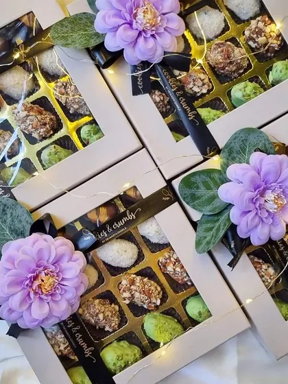 A closer look at my chocolate-coated stuffed dates. These beautifully decorated boxes were a huge hit for festive gifting.