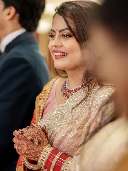 A candid moment from the reception. Her smile and the sparkle in her eyes show how confident and beautiful she felt in her glamorous makeup.
