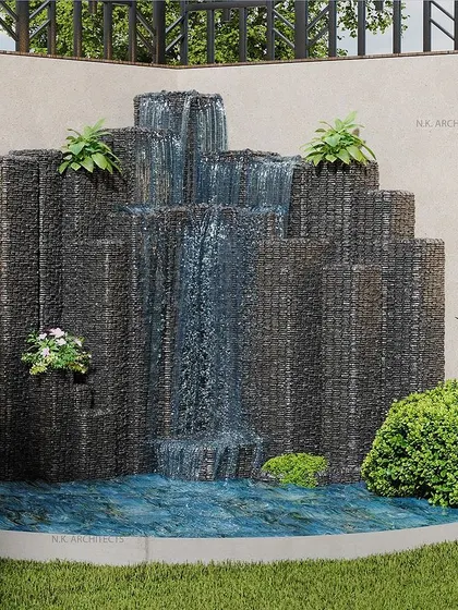 A custom water feature can transform a simple backyard into a tranquil oasis. We designed this cascading waterfall to create the soothing sound of flowing water, surrounded by lush greenery for a natural and relaxing atmosphere.