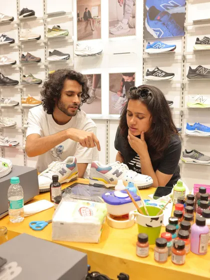 A big part of live art is the conversation. Here I am at the New Balance event, brainstorming ideas with a customer for his custom sneaker design. We work together to make sure the final piece is exactly what he envisions.