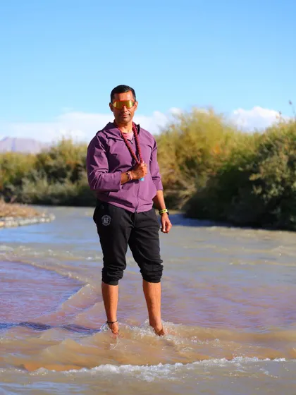Standing in the river, I take a moment to connect with nature and let my body recover.