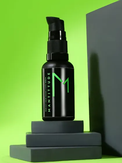 This shot uses geometric grey blocks to create a strong, architectural composition. The bold green background and clean lines give the men's skincare product a modern and masculine feel.
