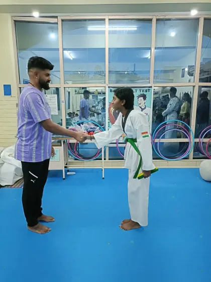 A handshake for a new green belt.