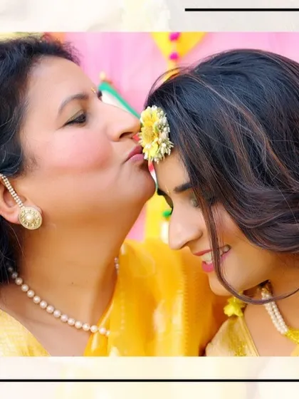 A tender moment between the bride and her mother during the Haldi ceremony, a memory to be cherished forever.