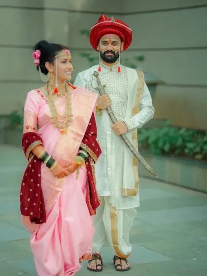 A classic portrait of the couple, highlighting the elegance of their wedding outfits and their calm, happy demeanor.