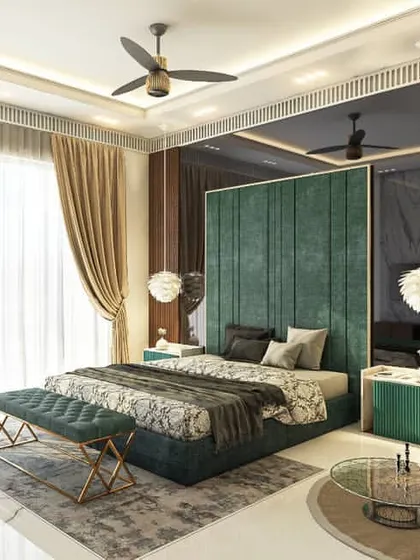 This bedroom design uses a rich color palette to create a warm and inviting space. The deep green velvet headboard contrasts beautifully with the warm wood-paneled wall, while pendant lights add a touch of modern style.