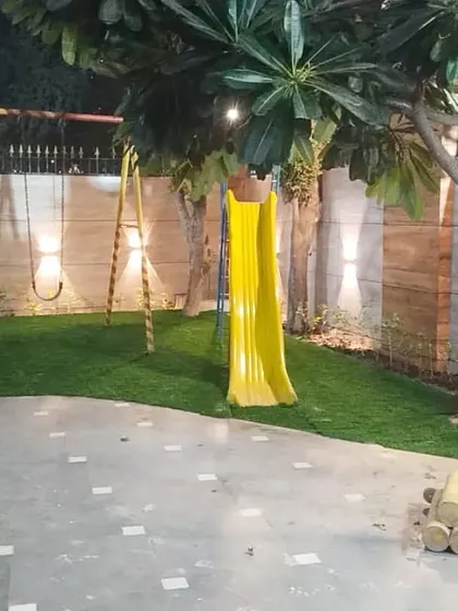 An artificial grass installation for a children's play area at Supertech Rameshwar RWA in Kaushambi. It's a perfect solution for community parks and residential societies.