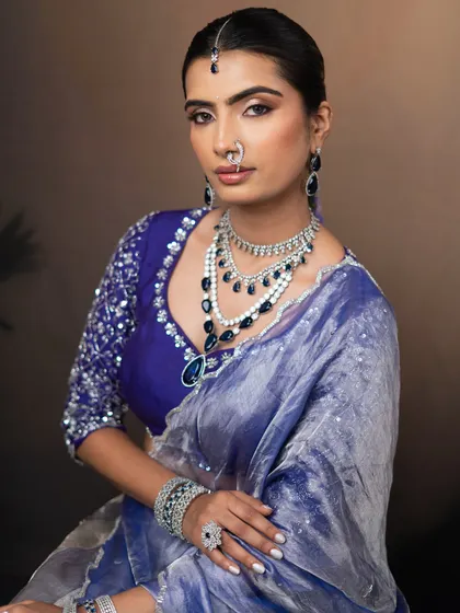 A seated portrait that exudes elegance and grace. The makeup is designed to look perfect from every angle.