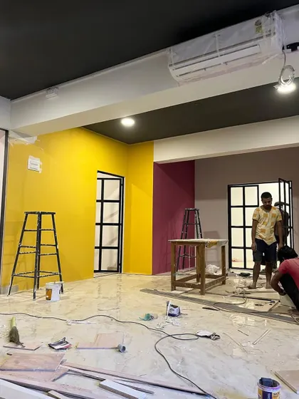 We love a pop of color in a commercial space. This vibrant yellow and magenta wall combination brings life and energy to this studio, making it a creative and inspiring place to be.