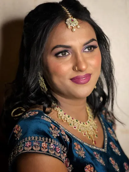 A profile shot showing the beautiful blend of the halo eyeshadow and the soft contouring that defines her features.