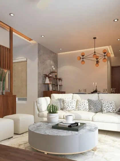 A modern fusion living room with a comfortable white sofa, a round marble coffee table, and a wooden slat partition with mirrored accents.