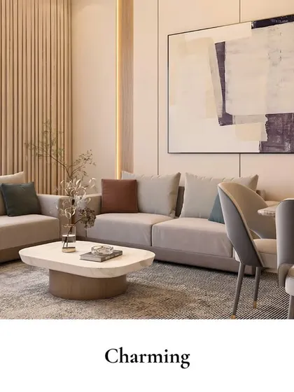 This open-plan living and dining area feels light and airy. The space is defined by a comfortable sectional sofa, a simple dining set, and a large piece of abstract art that ties the color palette together.