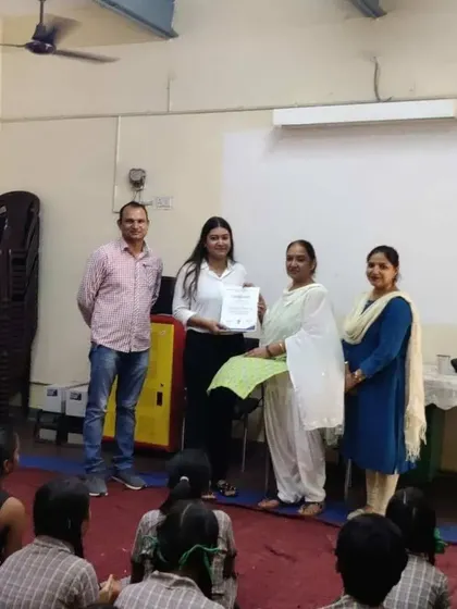 Receiving a certificate of appreciation after a session on legal careers. It is an honor to contribute to the education and development of future leaders.