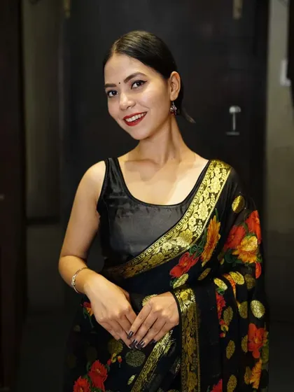 A simple black raw silk blouse, a versatile staple for any saree wardrobe. I offer custom stitching to ensure the perfect fit for these essential pieces.