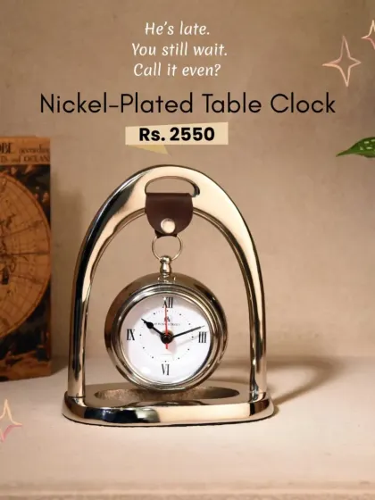 This nickel-plated table clock has a classic design, perfect for a side table or office desk. It's a timeless piece that adds function and style.