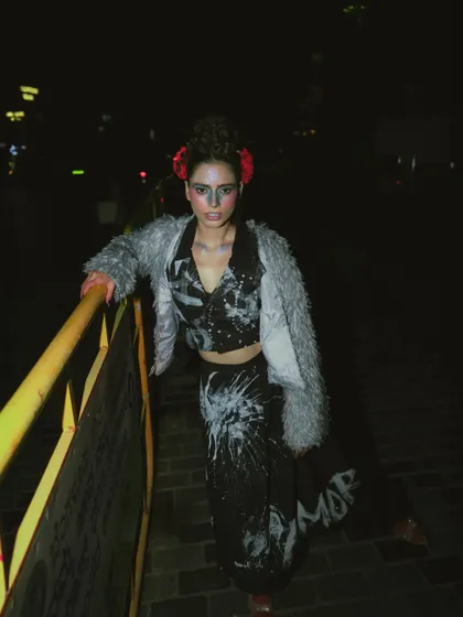 Another angle from the 'Lampione' shoot, showing the layered textures of the faux fur and printed top.