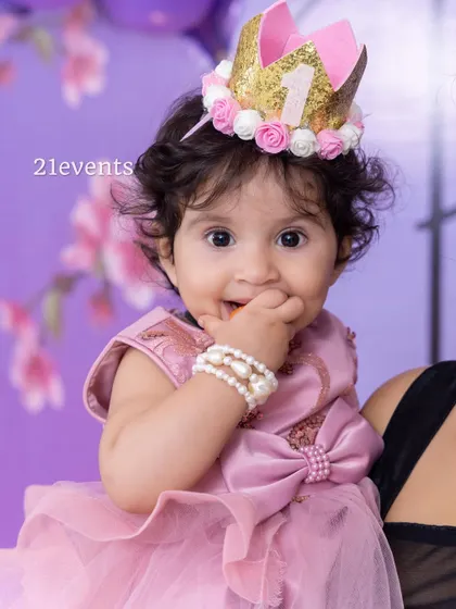A close-up of the birthday girl, looking adorable with her custom crown.