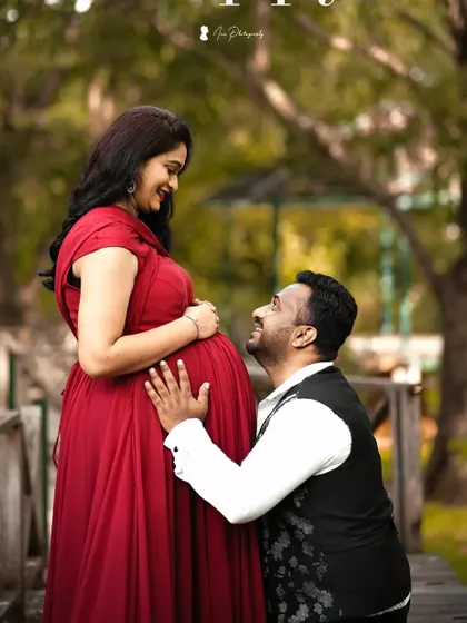 A tender moment during the maternity shoot. The makeup is soft and romantic, perfect for these cherished photos.