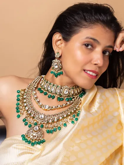 Modeling a stunning multi-layered bridal necklace with green beads, this shot shows how I can carry heavy, opulent jewellery with elegance.