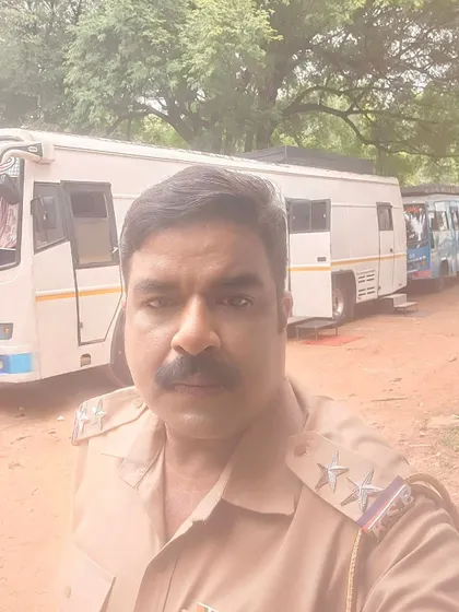 A selfie taken at Kanteerava Studio with the shooting bus in the background.