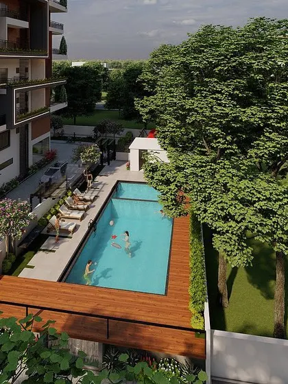 This aerial render shows the apartment's recreation area. The swimming pool and wooden deck are nestled beside a lawn, providing a private and luxurious amenity space for residents to relax and socialize.
