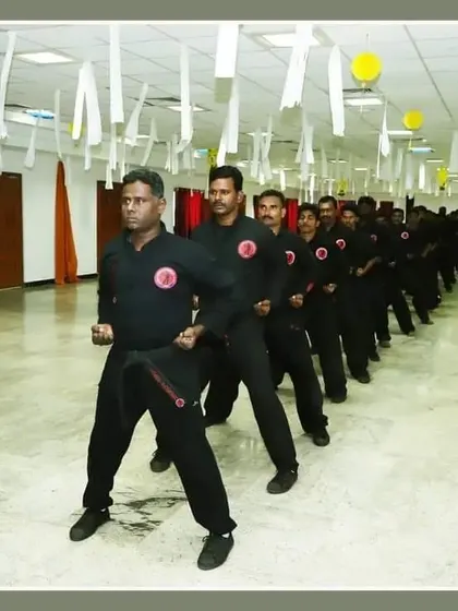 Inside our dojo, students stand in a perfect line, ready for the next drill. This image captures the order and discipline that is central to our training philosophy.