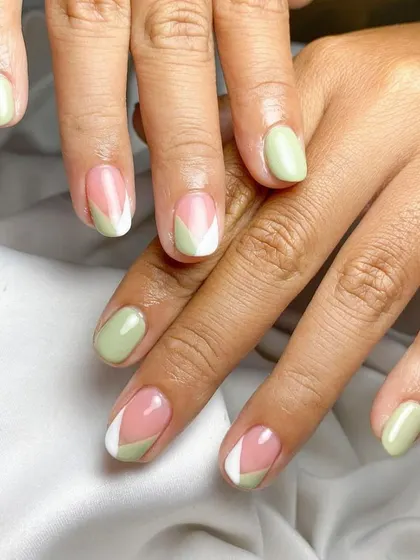 Fresh and modern. We used a lovely pistachio green for this geometric take on the French manicure, creating a clean and stylish look on short nails.