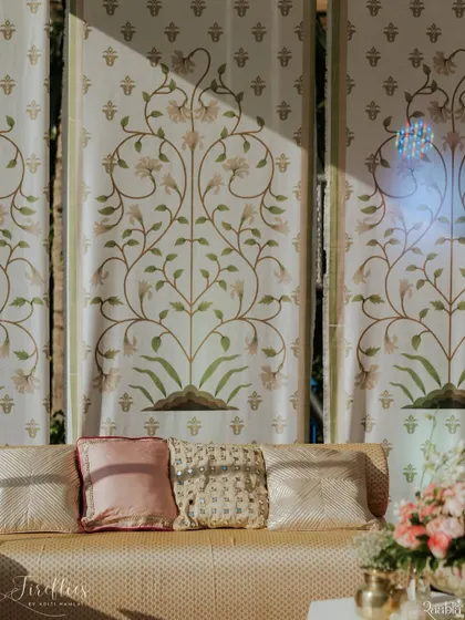 Custom-printed fabric panels with delicate floral motifs served as a beautiful backdrop for Aashvi and Akash's wedding. The soft ivory and green palette created a serene and elegant atmosphere.