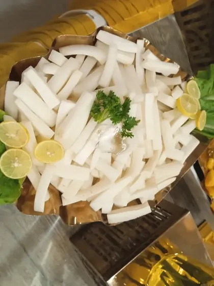 A bowl of crisp, fresh radish sticks, a simple and refreshing addition to my salad bar offerings.