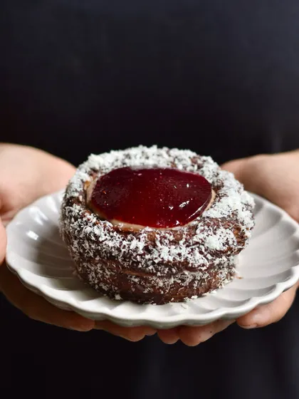 Our Lamington Croissant Cup, a weekend special that combines Australian inspiration with our baking style. The dark chocolate, coconut, and berry flavours are a perfect match for the rich croissant.