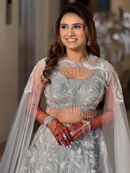 A happy and confident portrait of the bride on her sangeet night. The glittery eyes and soft curls are a perfect combination for a night of dancing.