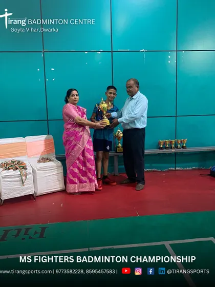 Celebrating the winner of a youth category. The joy of competition is central to the tournaments I organize.