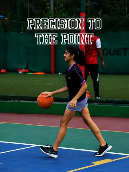 A young player dribbles with precision and focus. I teach the importance of ball control as the foundation of a great basketball player.