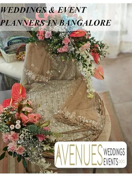 This is an example of how we pack traditional Indian attire. A beautifully embellished saree is draped in a basket and decorated with a cascade of fresh anthuriums and carnations for a luxurious presentation.