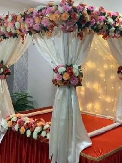 Here is another style of home mandap for religious ceremonies. I used white drapes with beautiful bouquets of artificial roses in pink, peach, and white to create a soft and elegant look for the celebration.