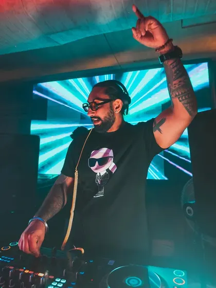 Hyping up the crowd at a club in Kolkata. My performance style is interactive and energetic, ensuring everyone feels like part of the show.