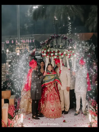 The bride's entrance under a phoolon ki chadar, a beautiful and traditional moment filled with anticipation.