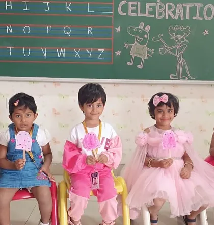 Our little ones enjoy pink cotton candy, a sweet treat to make Pink Day even more special.