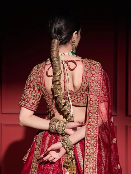 The back view of the Gota Braid shows the intricate wrapping technique and the small embellishments added for extra sparkle. This is a perfect style for a bride who wants something unique.
