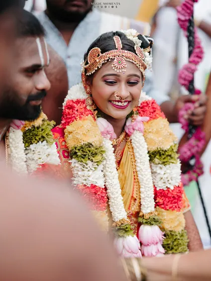 A candid shot of the bride's happy smile during the wedding rituals. These unposed moments are priceless.