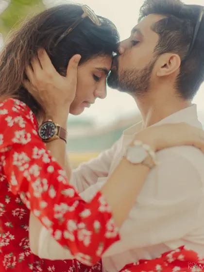 A tender forehead kiss, a universal sign of love and protection, captured in a close-up full of emotion.