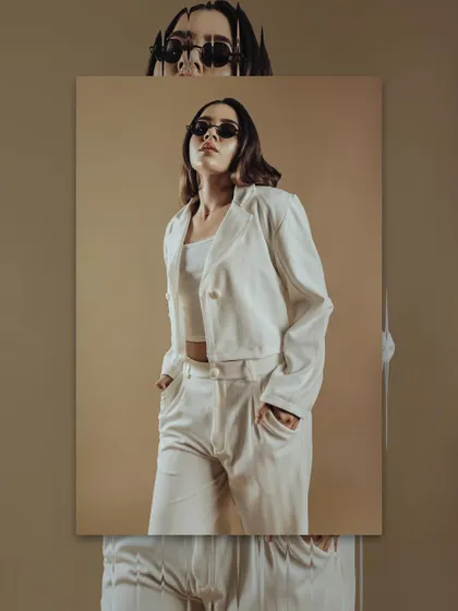 This shot shows how accessories, like sunglasses, can be incorporated into a look. I guide students on how to adapt makeup to fit the overall styling of a shoot.