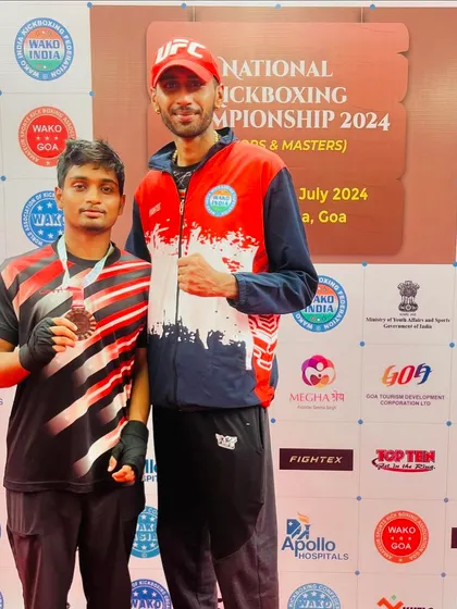 Standing with one of our national-level medalists. This fighter traveled to Goa and proved his skills against the country's best.
