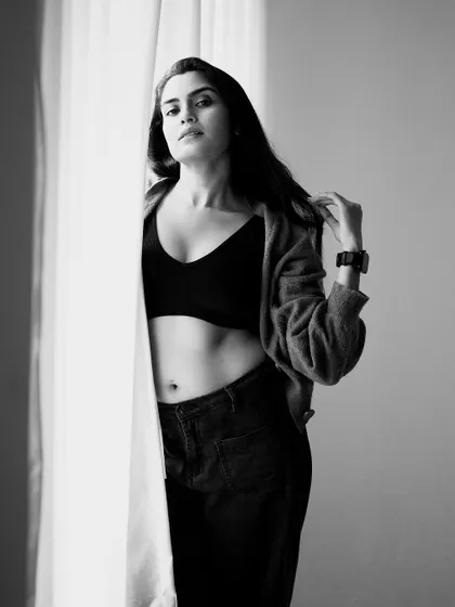 A slightly different angle, capturing a look of confidence and strength. The black and white edit makes the portrait feel classic and bold.