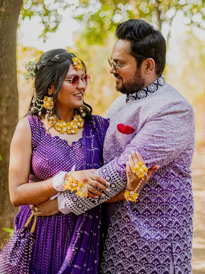 A romantic portrait of the couple during their Haldi ceremony. Their coordinated outfits and loving gaze make for a beautiful photograph.