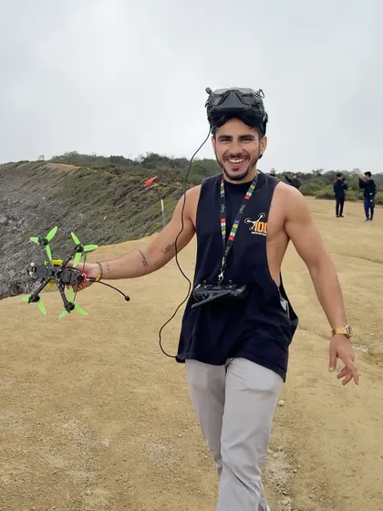 A happy moment on location, holding my drone with a smile. The joy of flying in incredible places is what fuels my passion for this craft.