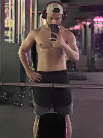 Another angle showcasing the hard-earned physique after months of dedication. Our programs are designed to help you achieve the look you've been working for.