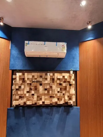 This shot shows the custom-built 3D wooden diffuser in our studio. It's a key part of our acoustic design, scattering sound waves to create a natural and spacious audio environment.